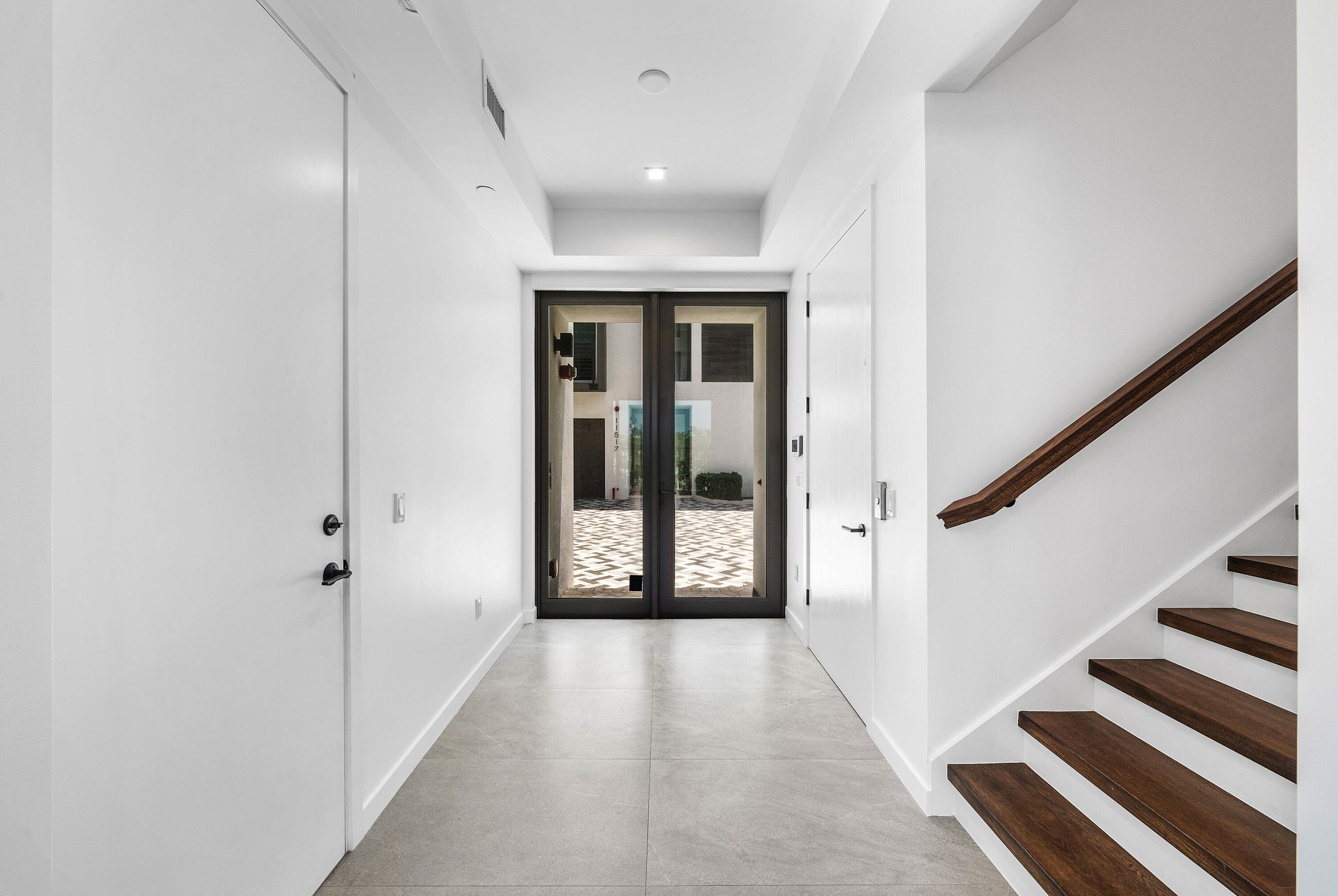 11505 Old Ocean Boulevard Ocean Ridge, FL 33435 - Photo 8 of 35 a view of a hallway with wooden floor and entryway