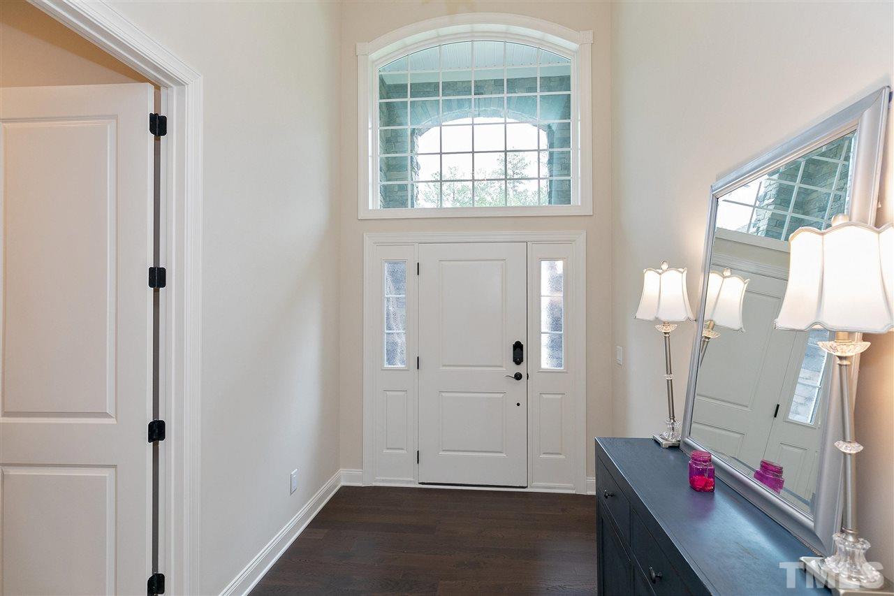 2519 Range Overlook Crossing Apex, NC 27523 - Photo 3 of 26 a view of room with window and wooden floor