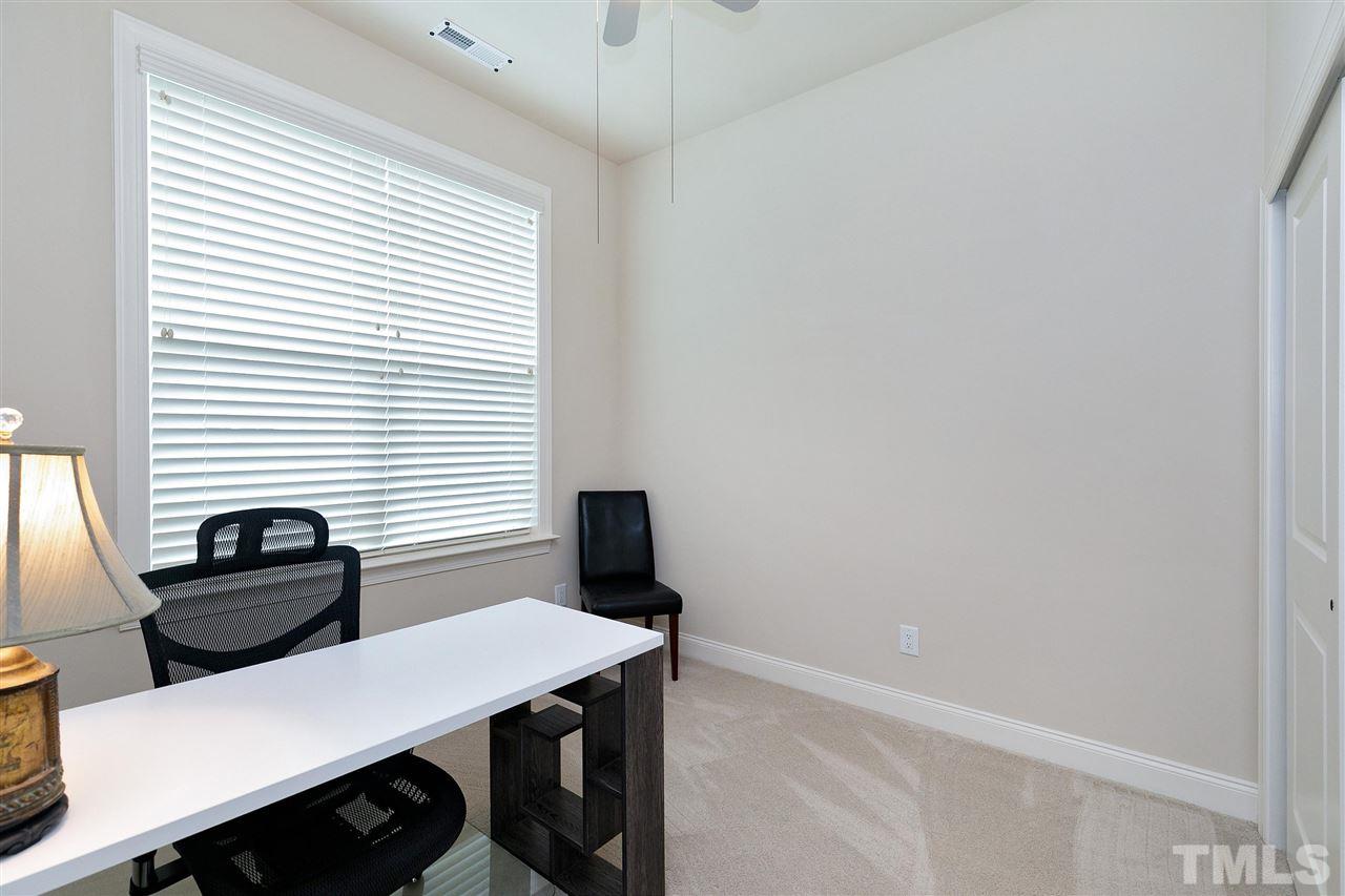 2519 Range Overlook Crossing Apex, NC 27523 - Photo 21 of 26 a view of a workspace with furniture and a window