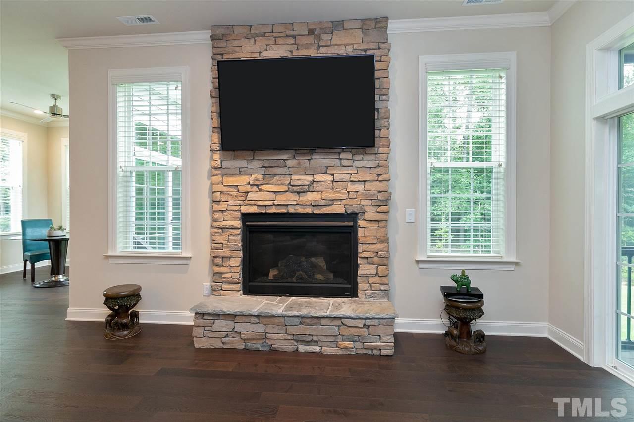2519 Range Overlook Crossing Apex, NC 27523 - Photo 10 of 26 a living room with furniture and a fireplace