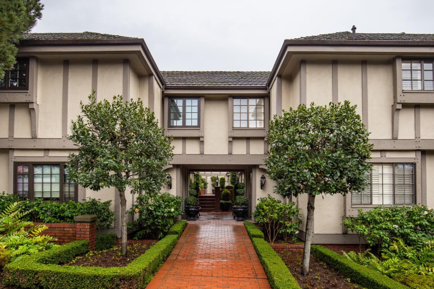a front view of a house with garden