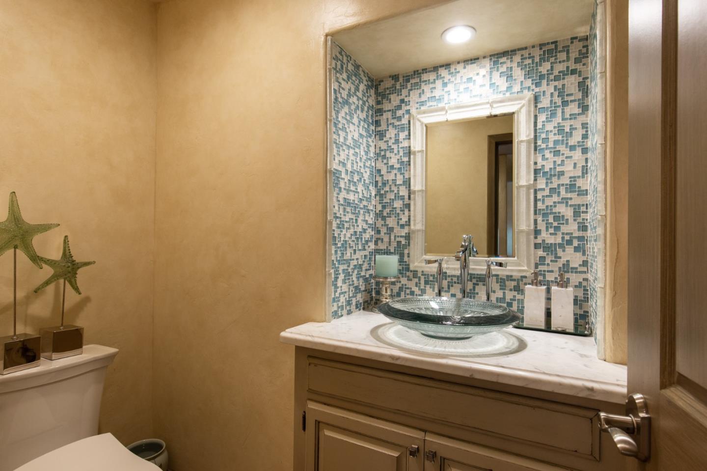 0 Southwest Sw Corner, Unit F Carmel, CA 93921 - Photo 12 of 19 a bathroom with a sink and a mirror