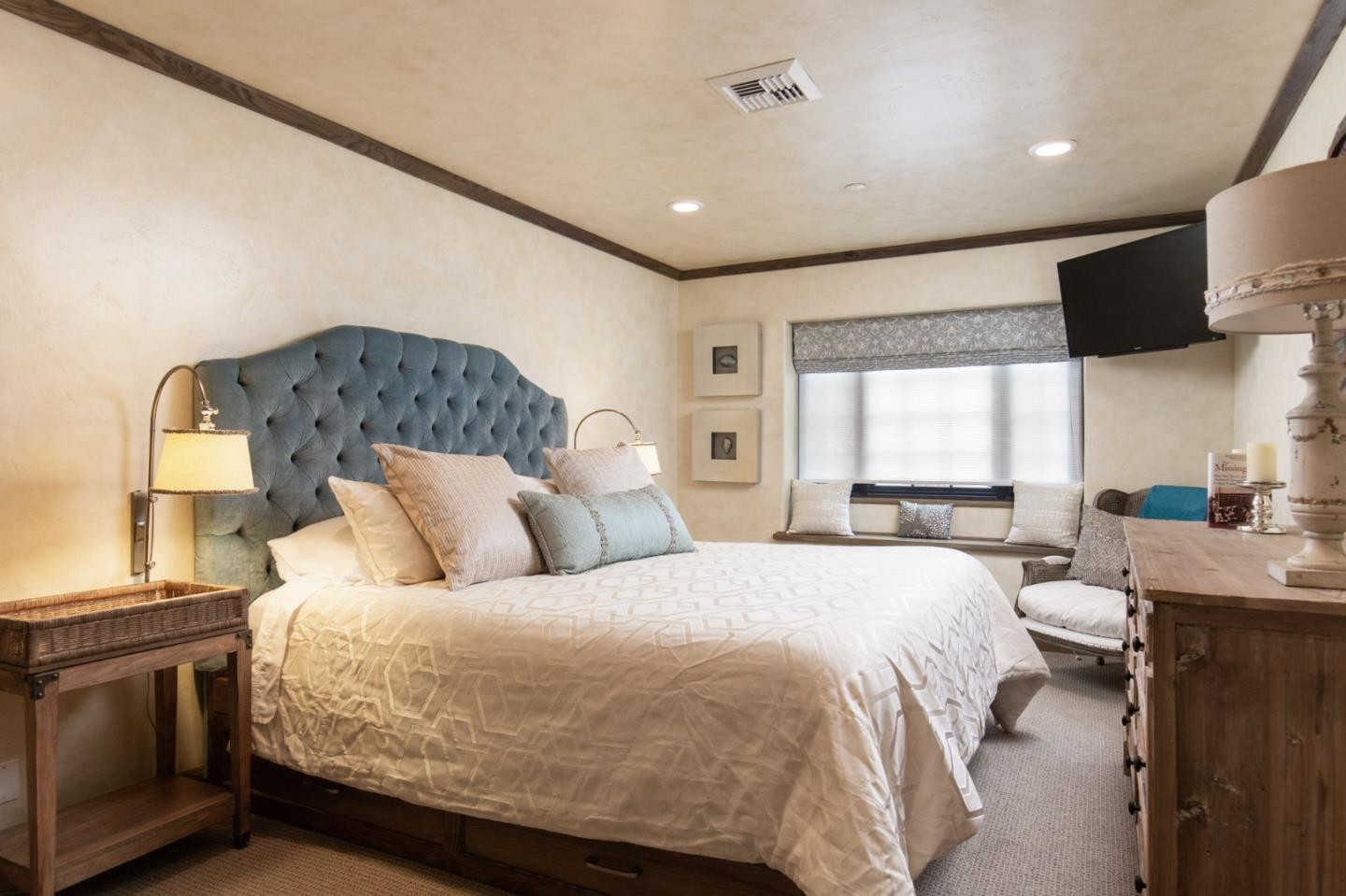 0 Southwest Sw Corner, Unit F Carmel, CA 93921 - Photo 14 of 19 a bed room with a bed and a television