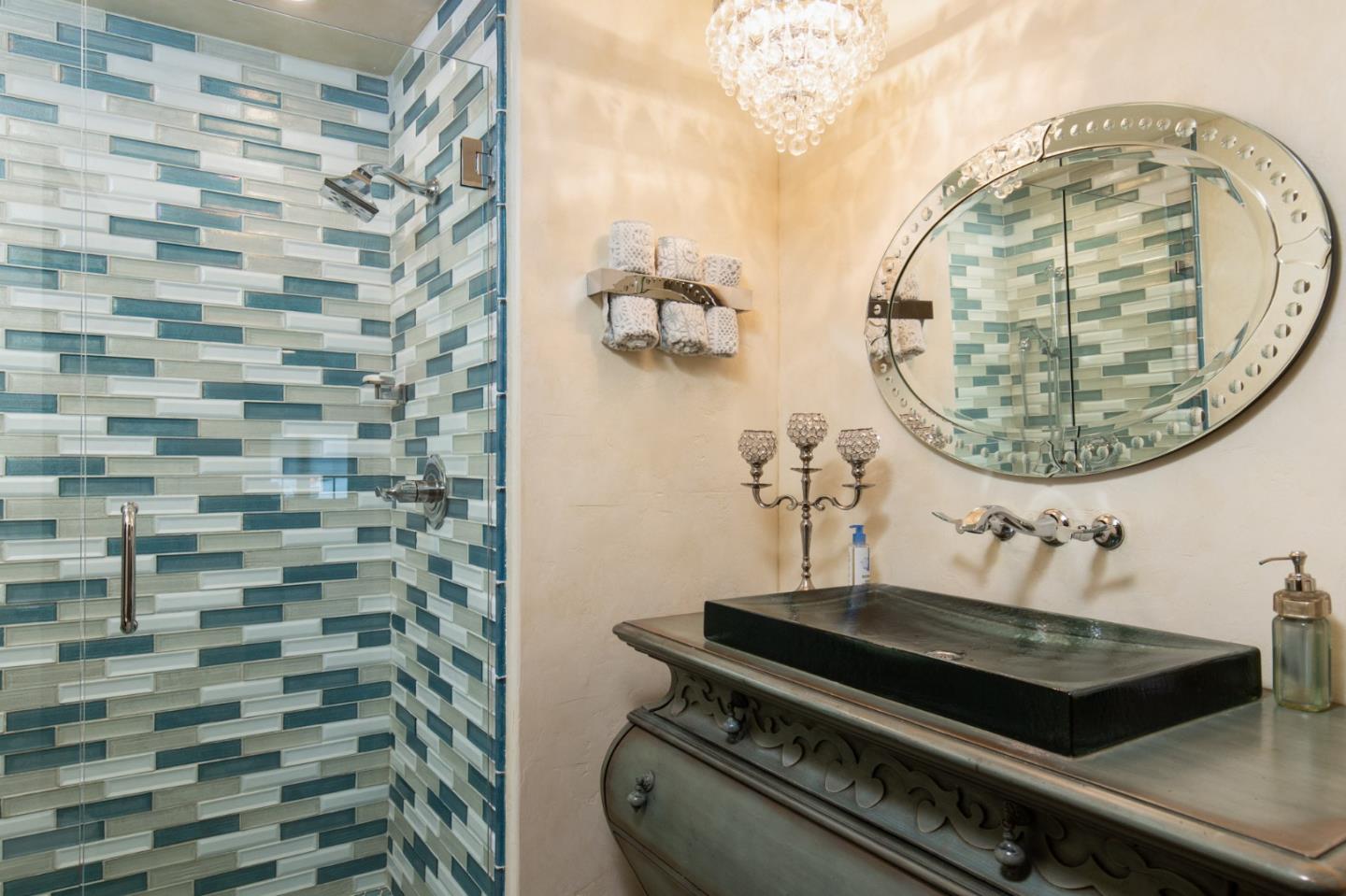 0 Southwest Sw Corner, Unit F Carmel, CA 93921 - Photo 15 of 19 a bathroom with a sink a mirror and a shower