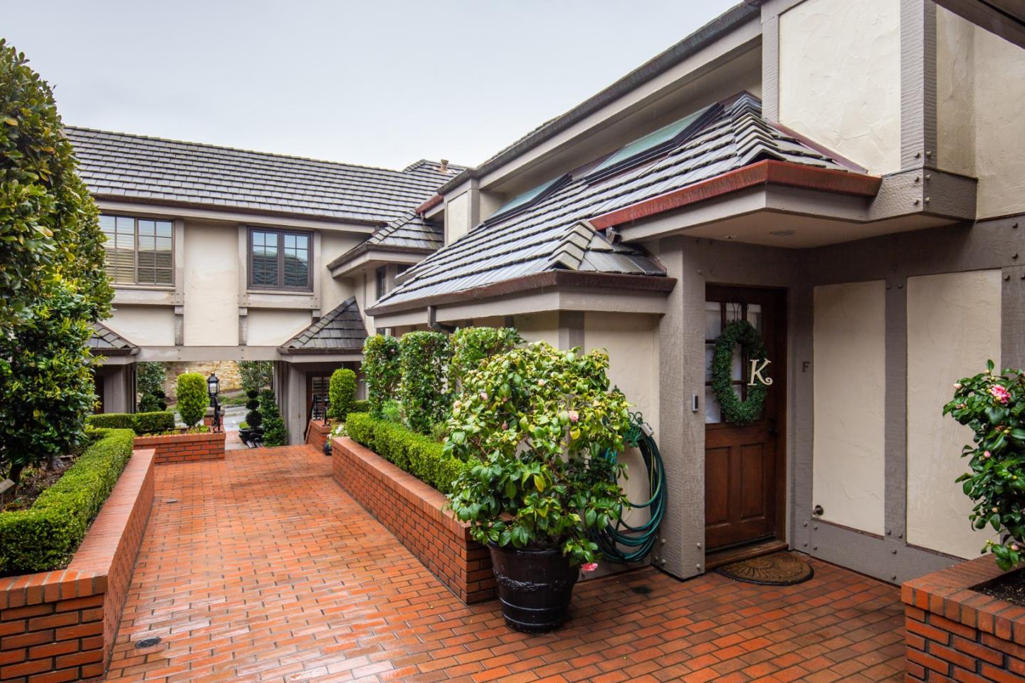 0 Southwest Sw Corner, Unit F Carmel, CA 93921 - Photo 4 of 19 a front view of a house with a yard