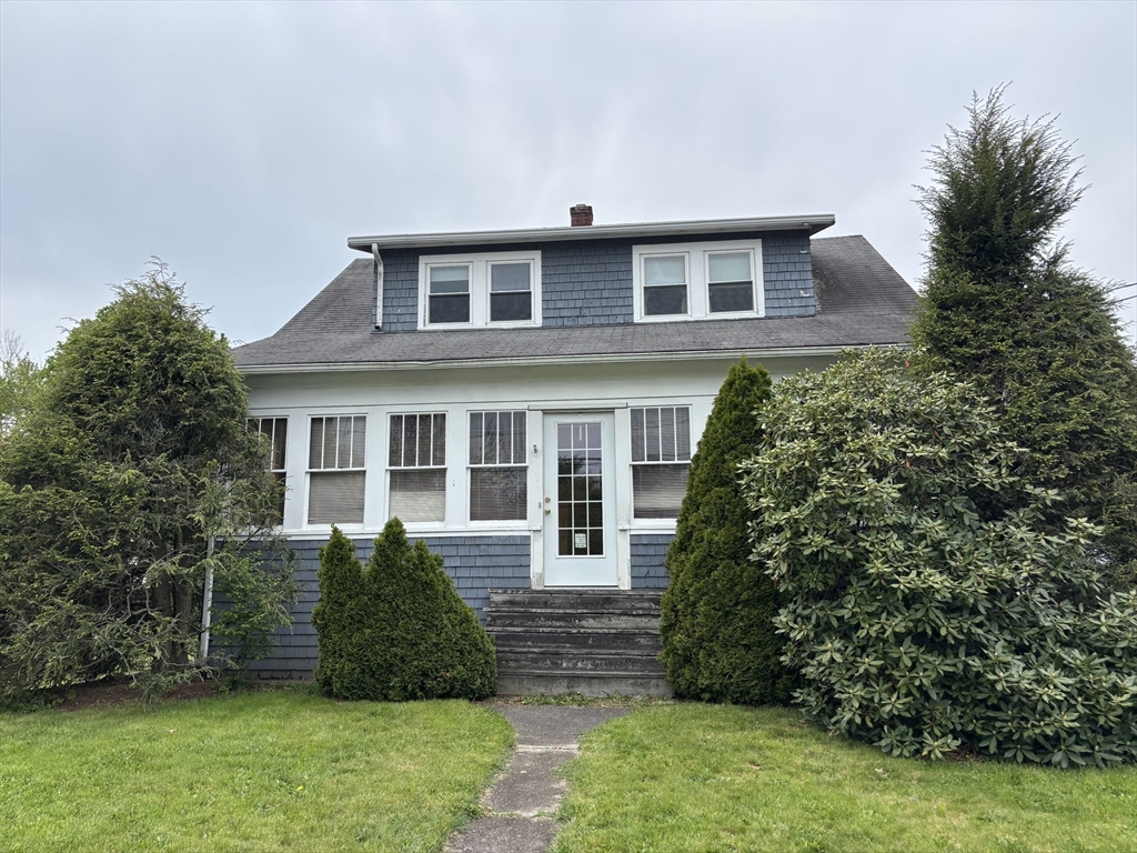 577 County Street Taunton, MA 02780 - Photo 1 of 23 a front view of a house with a yard