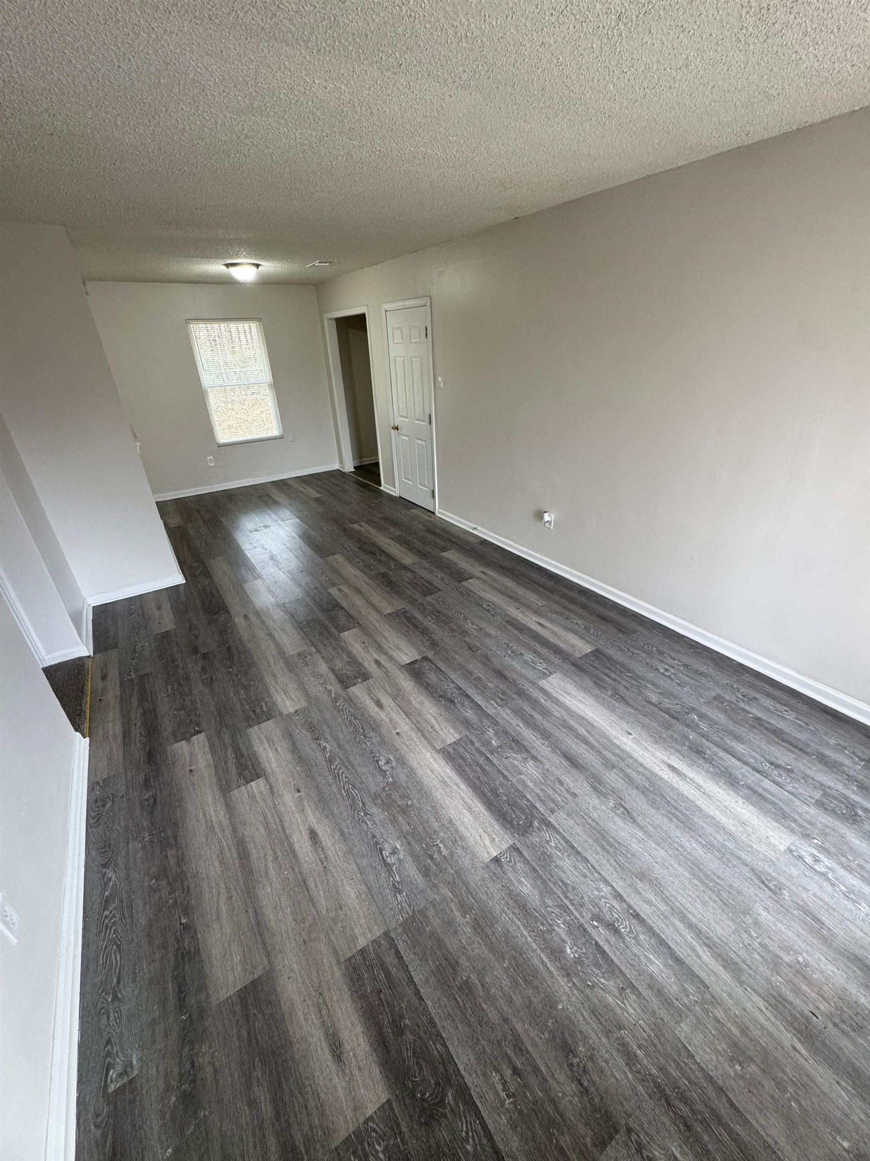 4528 Sugar Creek Road Memphis, TN 38118 - Photo 14 of 19 a view of empty room with wooden floor