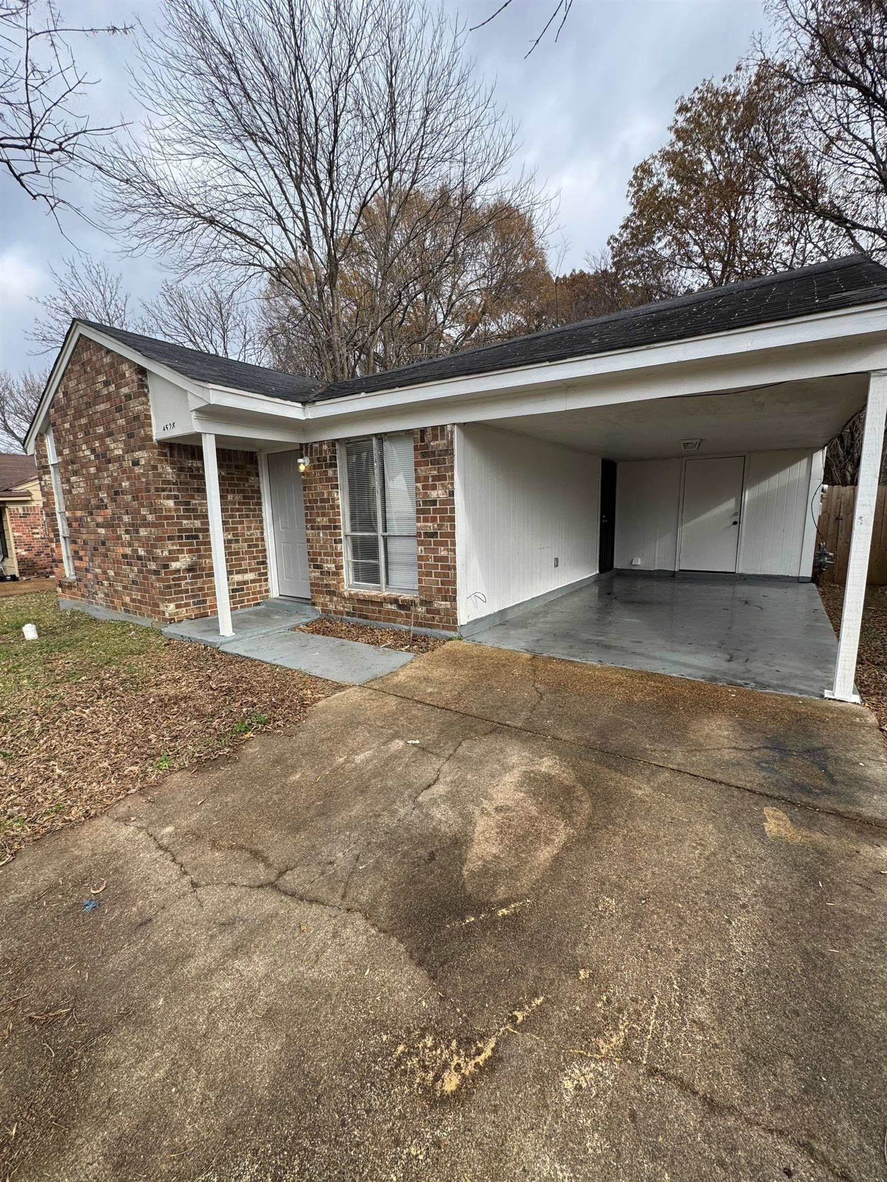 4528 Sugar Creek Road Memphis, TN 38118 - Photo 17 of 19 a view of a house with a yard and garage