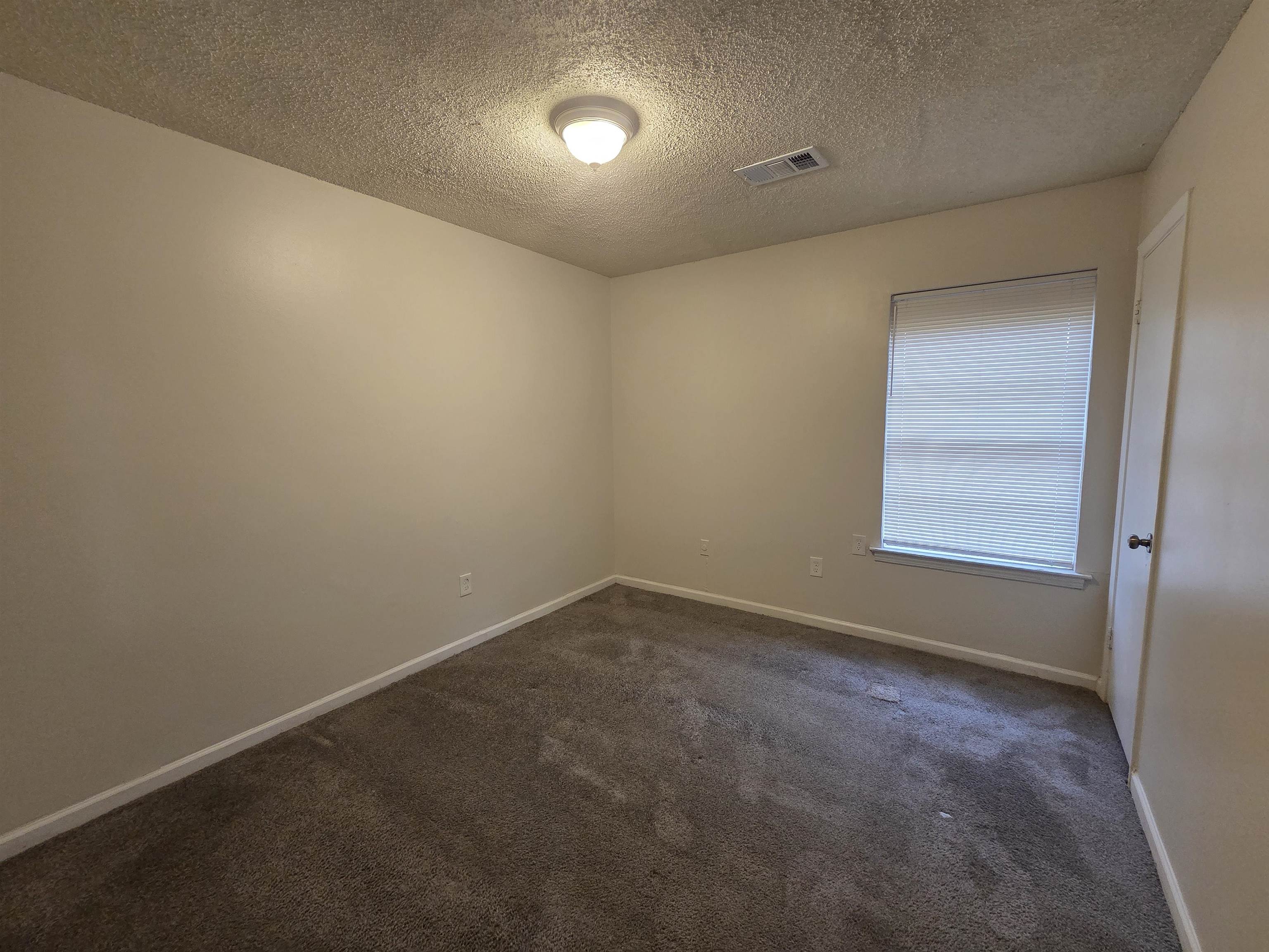 4528 Sugar Creek Road Memphis, TN 38118 - Photo 24 of 40 an empty room with a empty space and windows