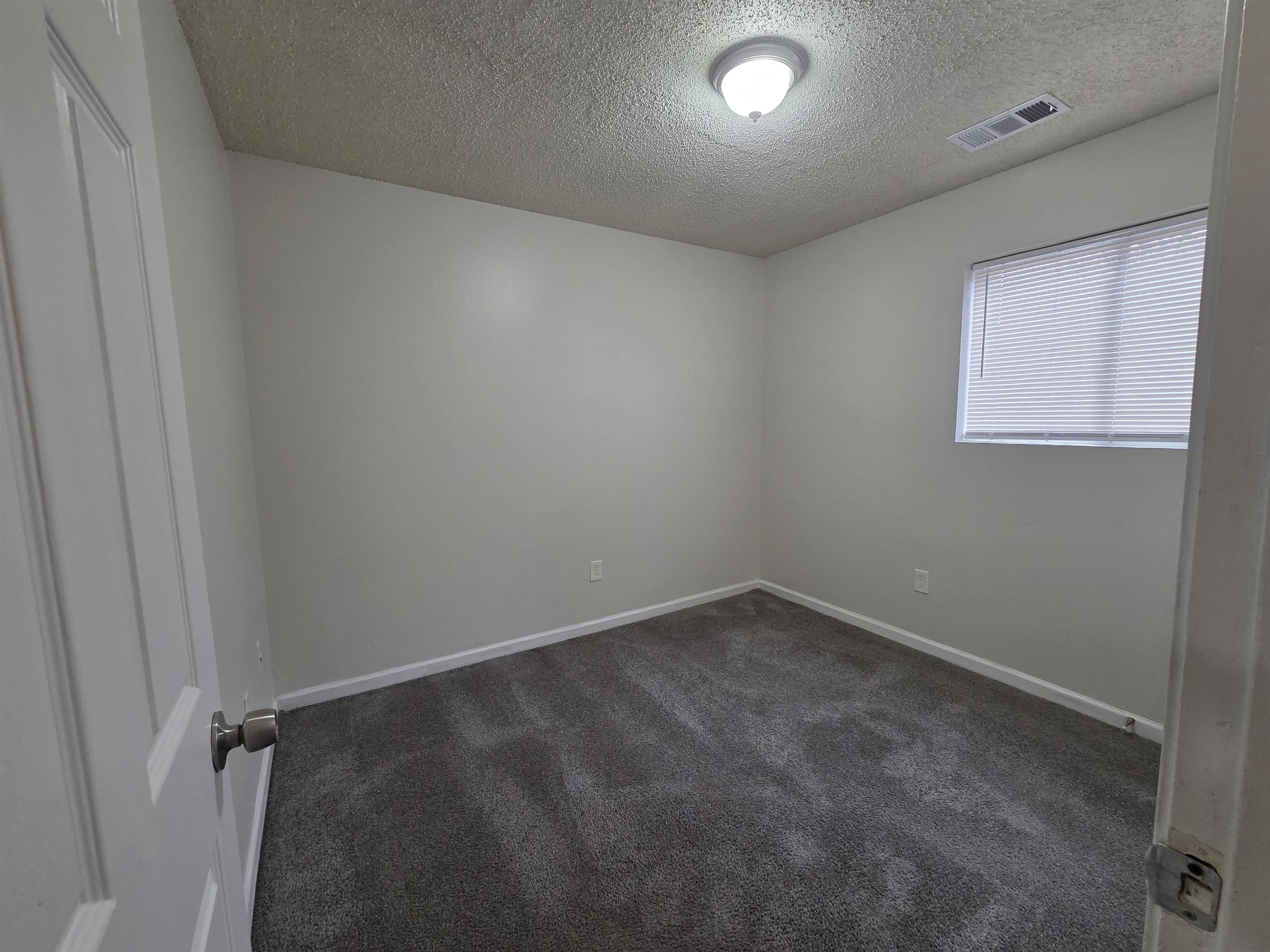4528 Sugar Creek Road Memphis, TN 38118 - Photo 26 of 40 an empty room with a window