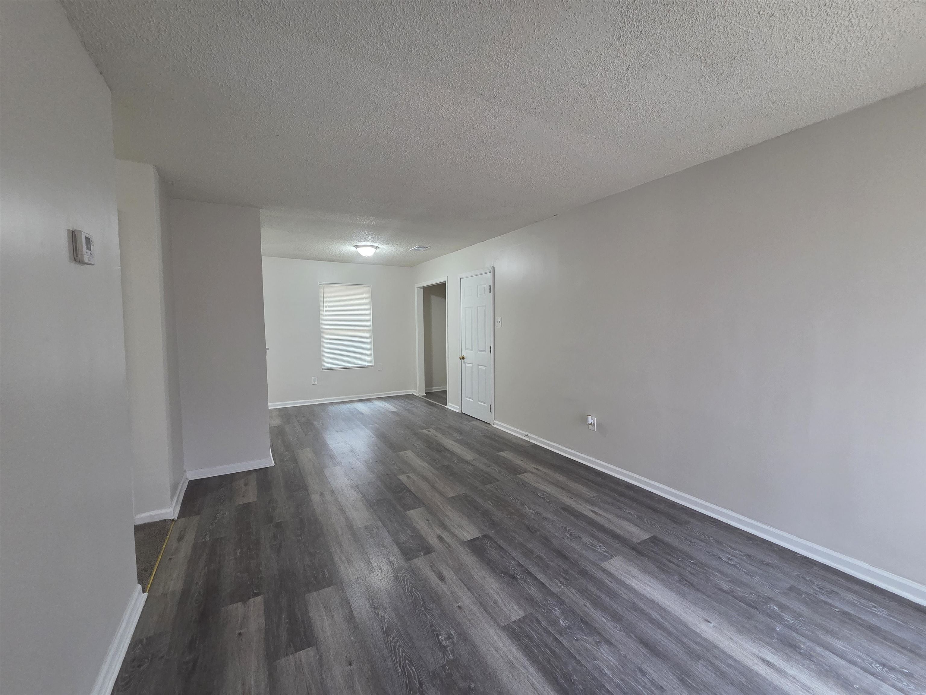 4528 Sugar Creek Road Memphis, TN 38118 - Photo 28 of 40 a view of wooden floor and windows in a room