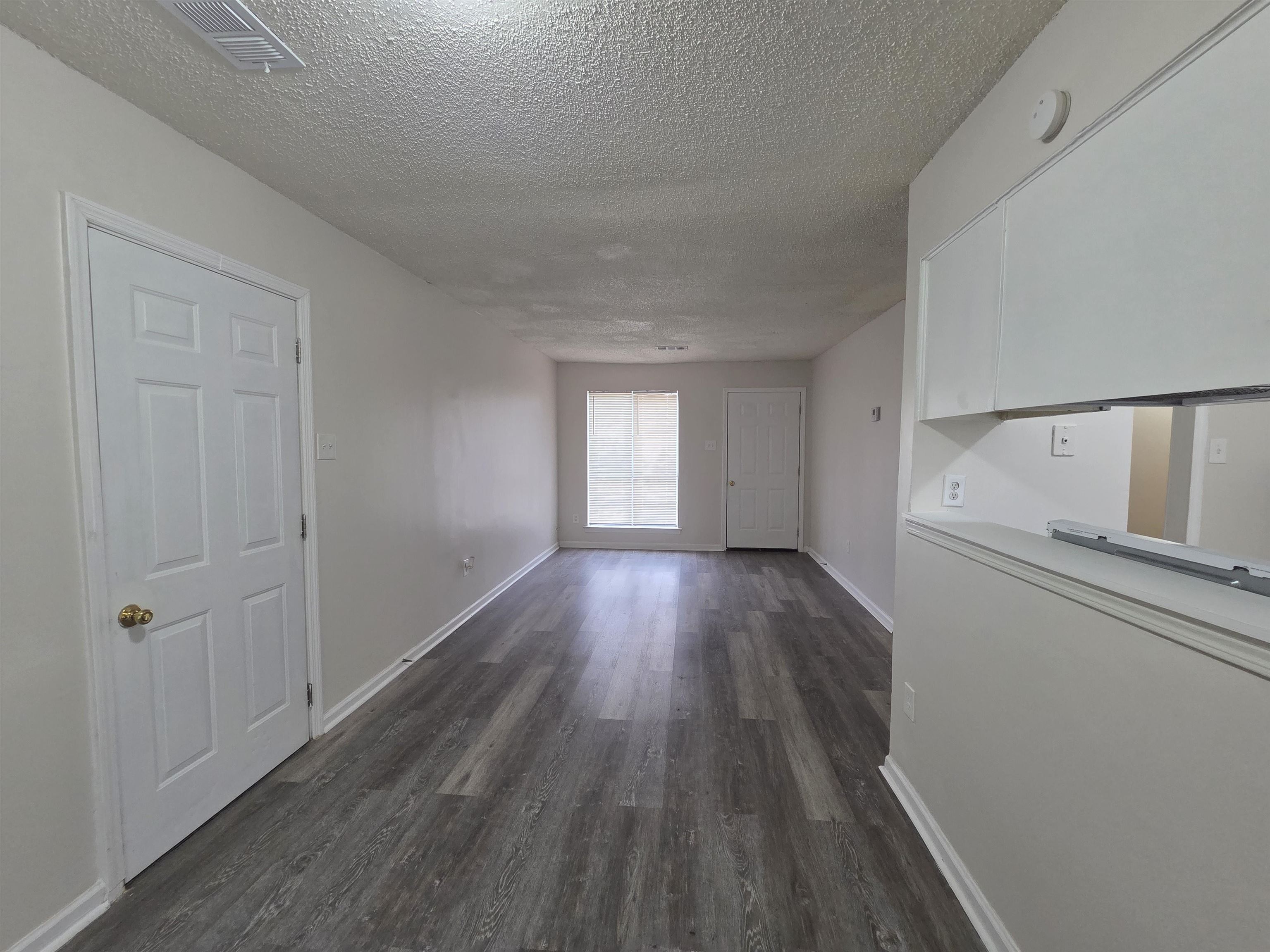 4528 Sugar Creek Road Memphis, TN 38118 - Photo 29 of 40 a view of empty room with wooden floor and fan