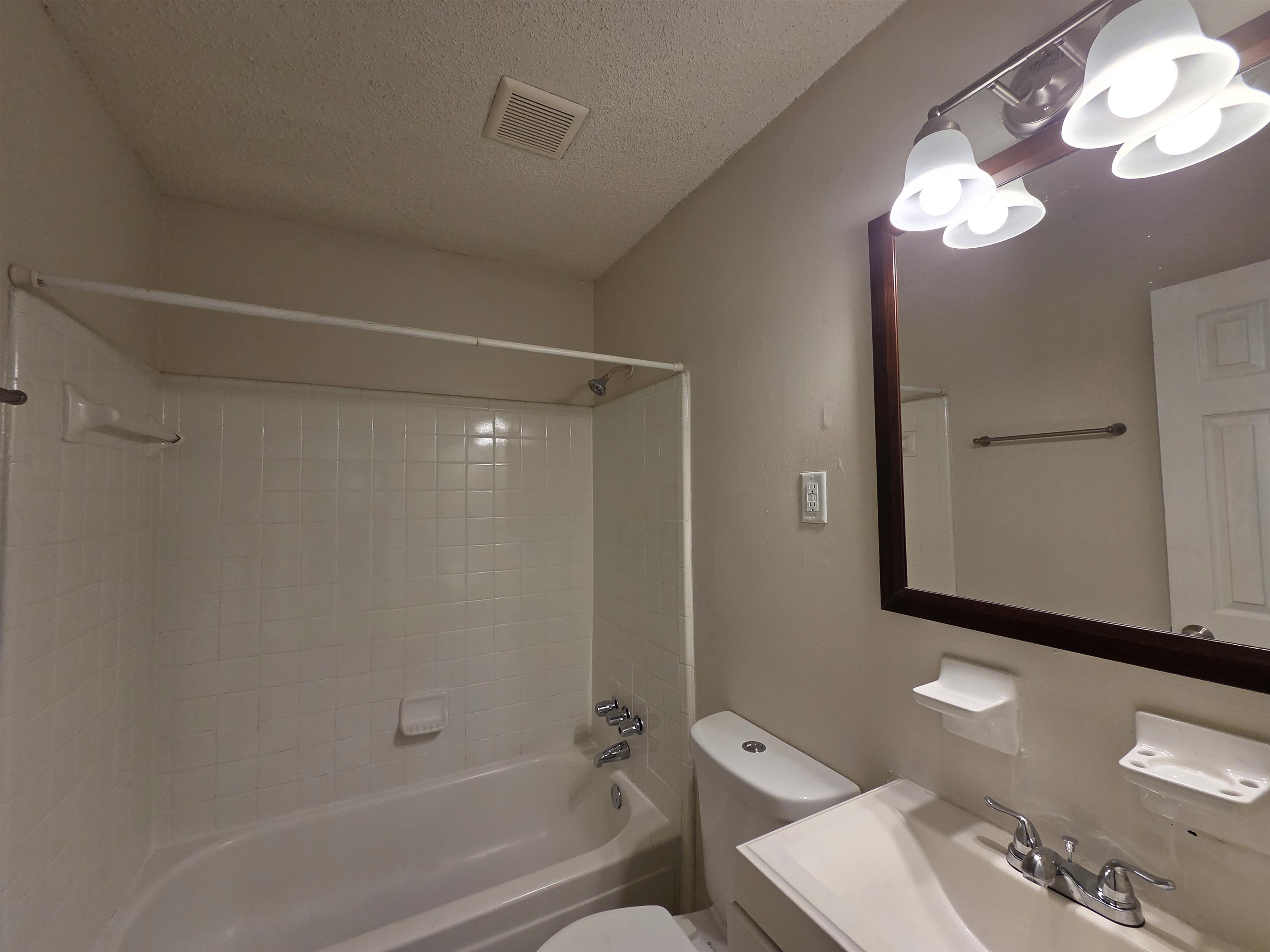 4528 Sugar Creek Road Memphis, TN 38118 - Photo 38 of 40 a bathroom with a toilet a sink and bathtub