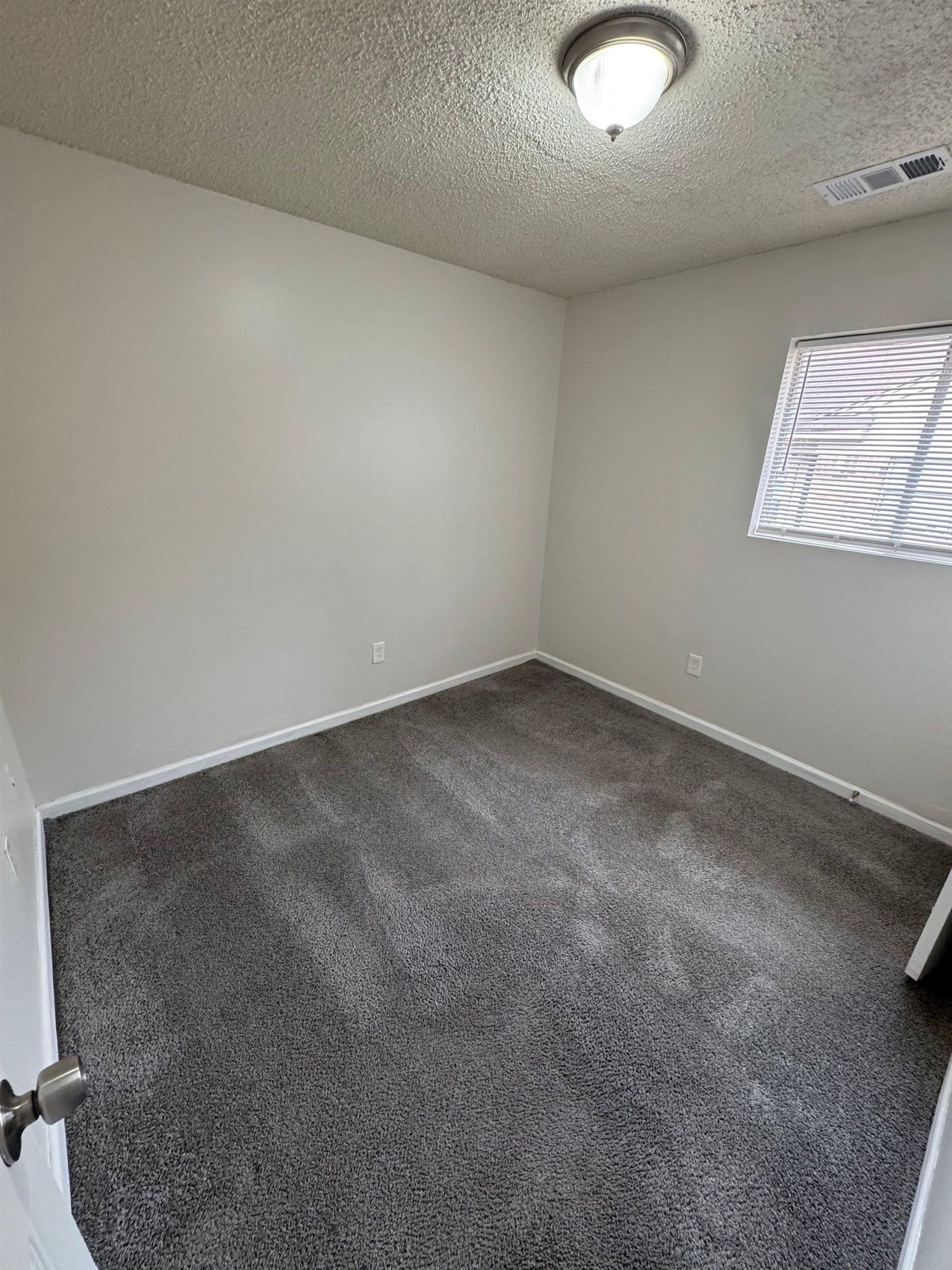 4528 Sugar Creek Road Memphis, TN 38118 - Photo 5 of 19 an empty room with a workbench