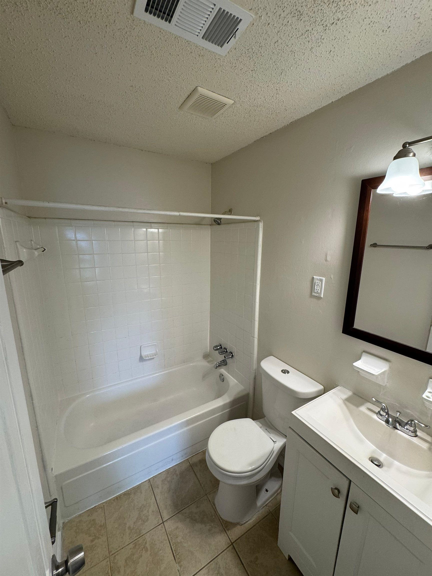 4528 Sugar Creek Road Memphis, TN 38118 - Photo 6 of 19 a bathroom with a toilet a sink a mirror and bathtub