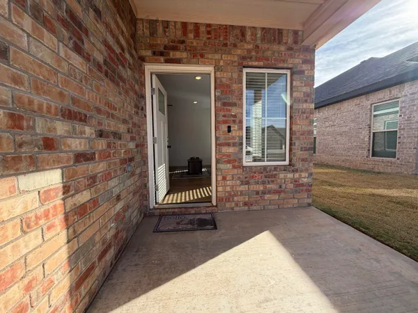 a view of house with backyard