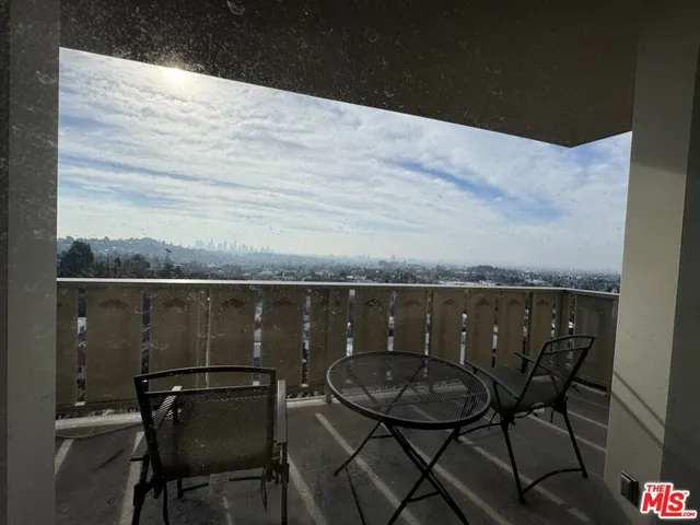 a terrace with a table and chairs