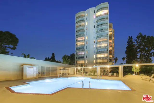 a view of a building with floor to ceiling windows