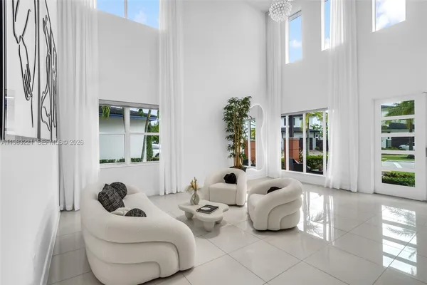 a living room with furniture and a large window
