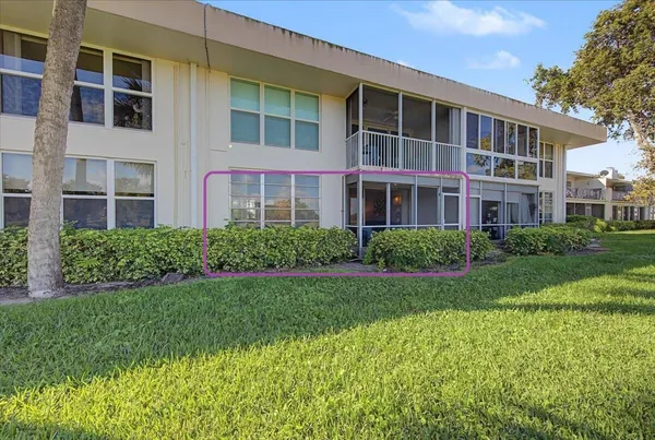 a front view of a building with garden
