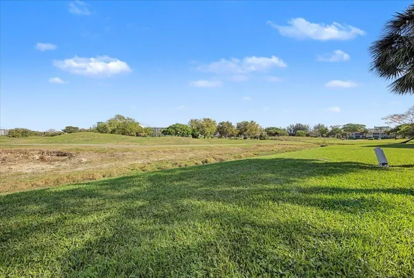 a view of a lake with houses in the back
