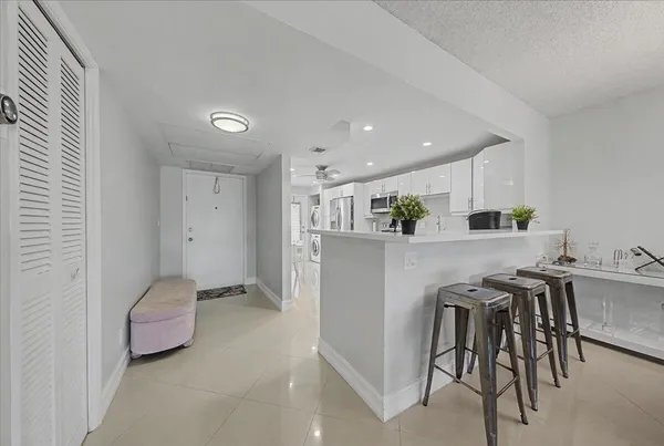 a kitchen with a table and chairs in it