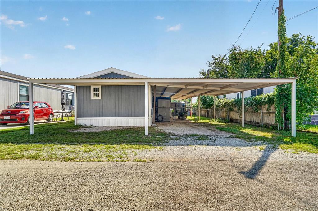 6602 Ashley Court Granbury, TX 76049 - Photo 20 of 35 Extended carport structure providing covered parking