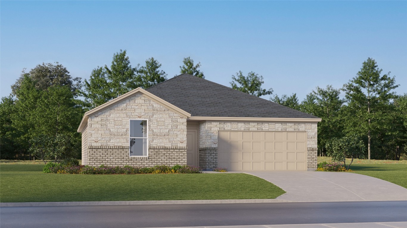 2206 Jeter Drive Bryan, TX 77807 - Photo 1 of 26 a view of a yard in front of a house with plants and large tree
