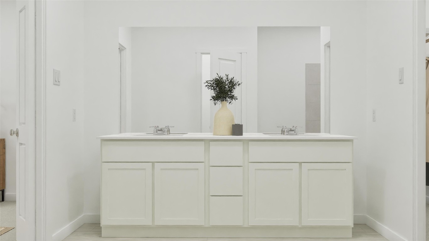2206 Jeter Drive Bryan, TX 77807 - Photo 20 of 26 a bathroom with a sink and mirror