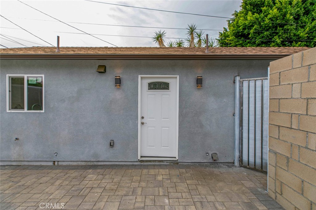 13120 Branford Street Arleta, CA 91331 - Photo 14 of 16 a front view of a house with a garden