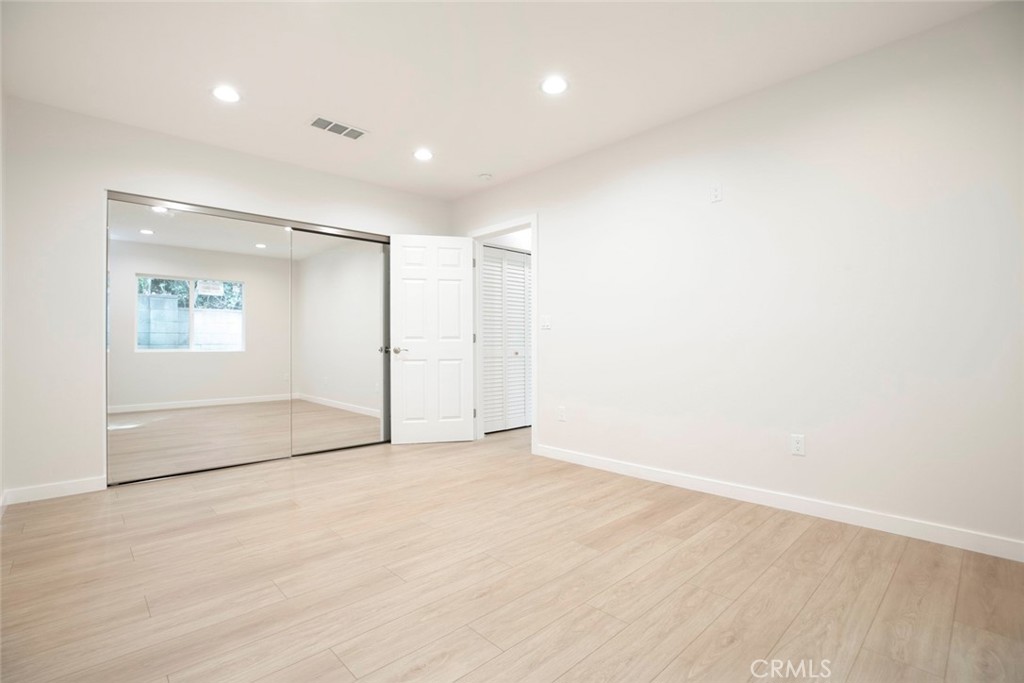 13120 Branford Street Arleta, CA 91331 - Photo 9 of 16 an empty room with a empty space and windows