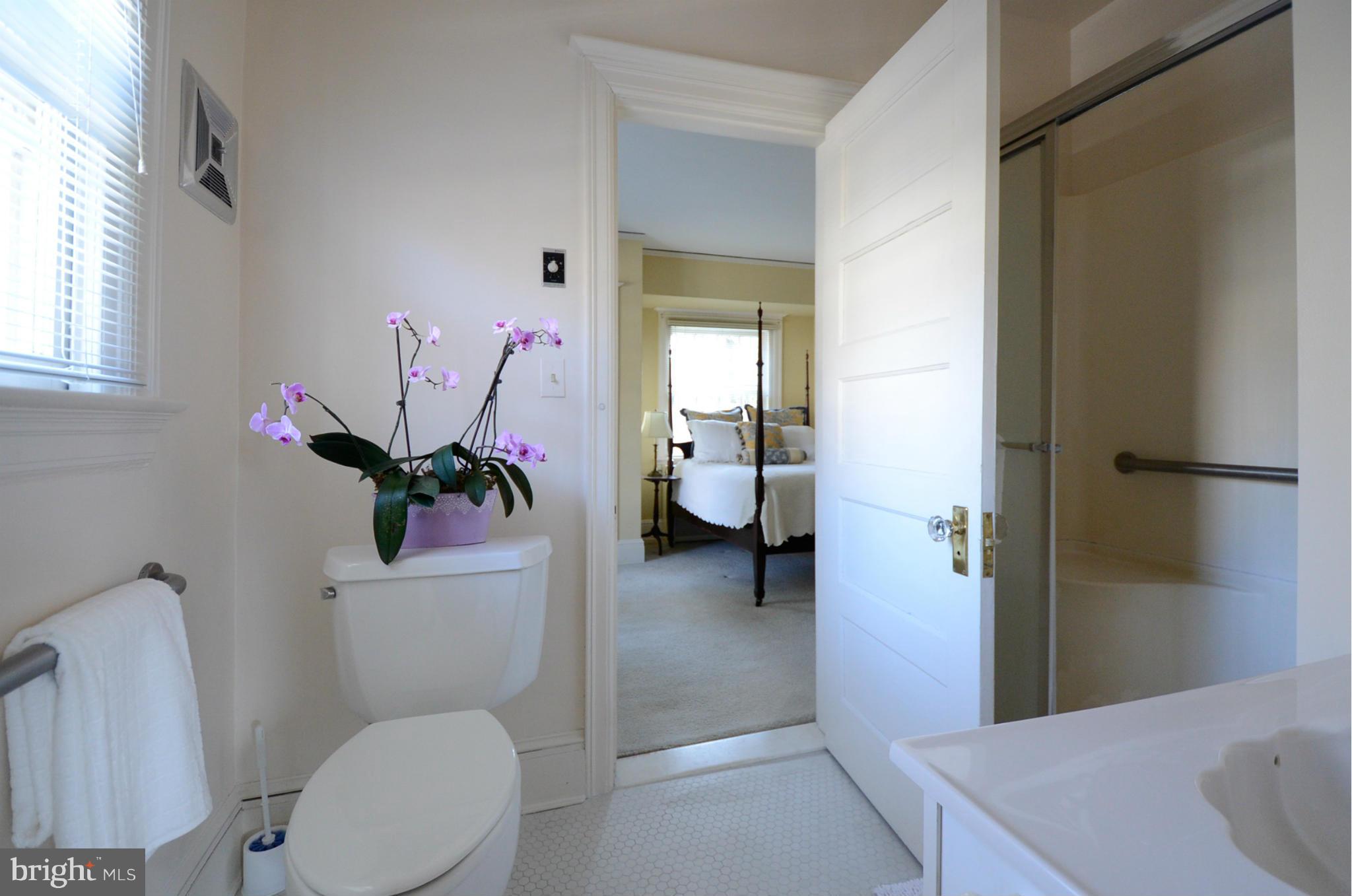 103 Elmwood Road Baltimore, MD 21210 - Photo 22 of 30 a bathroom with a sink a toilet and a shower
