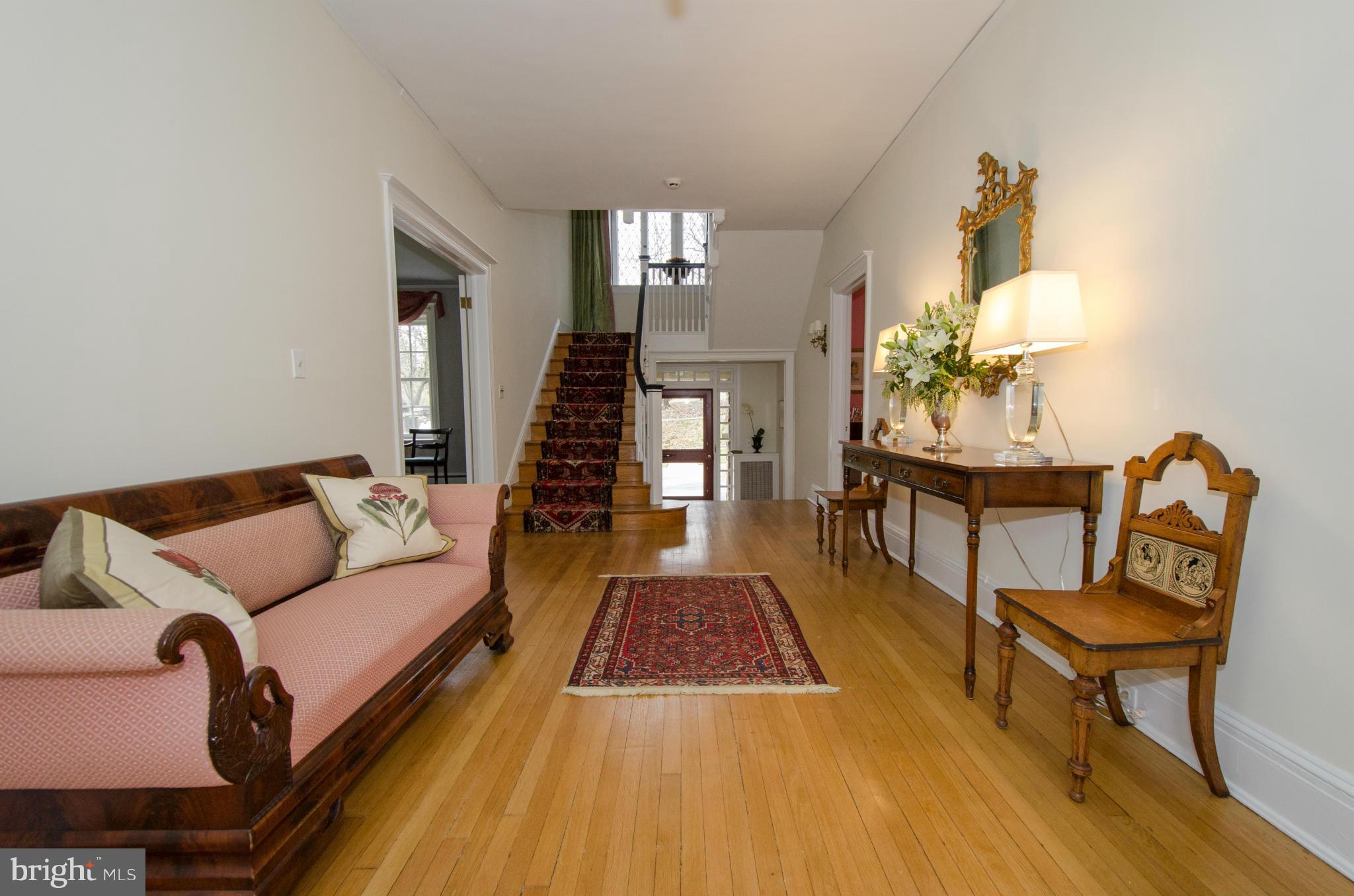 103 Elmwood Road Baltimore, MD 21210 - Photo 4 of 30 a living room with furniture and a rug