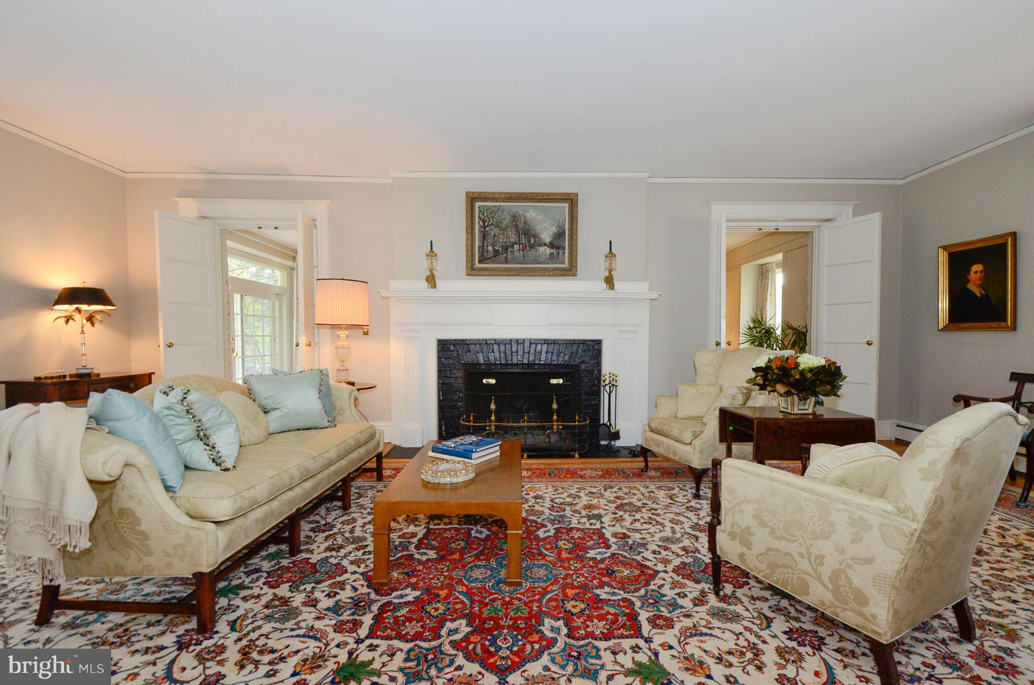 103 Elmwood Road Baltimore, MD 21210 - Photo 5 of 30 a living room with furniture and a fireplace