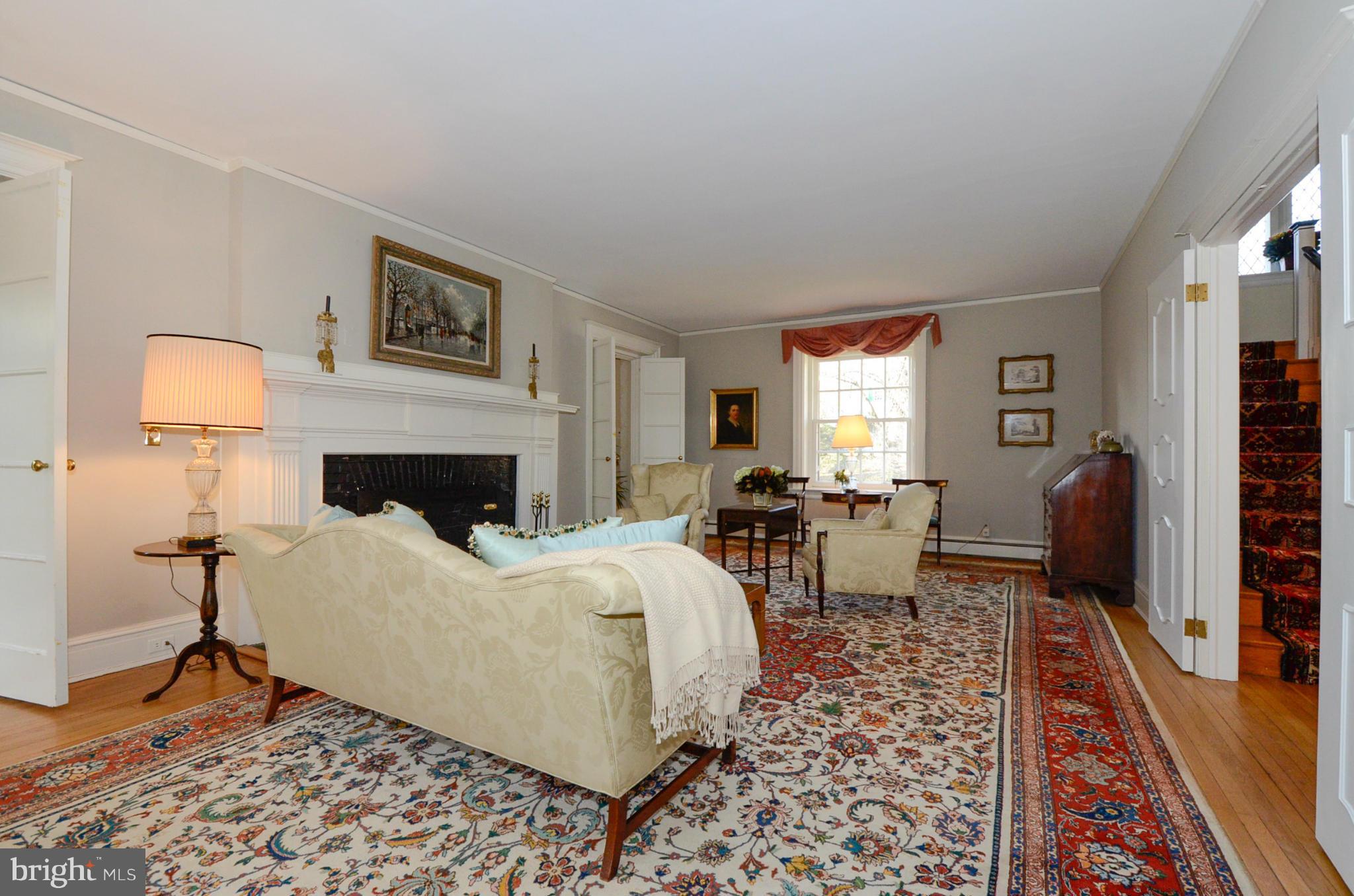 103 Elmwood Road Baltimore, MD 21210 - Photo 8 of 30 a living room with furniture and a fireplace
