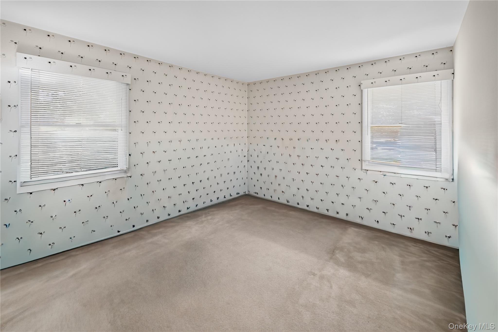 261 Hallock Road Stony Brook, NY 11790 - Photo 8 of 13 a view of an empty room with a window