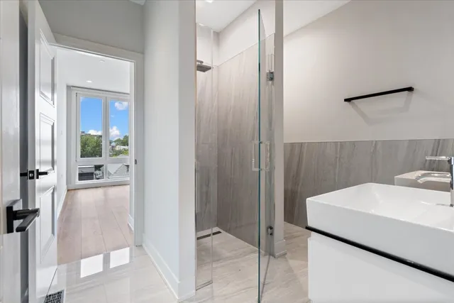 a bedroom with a large bed and a large window