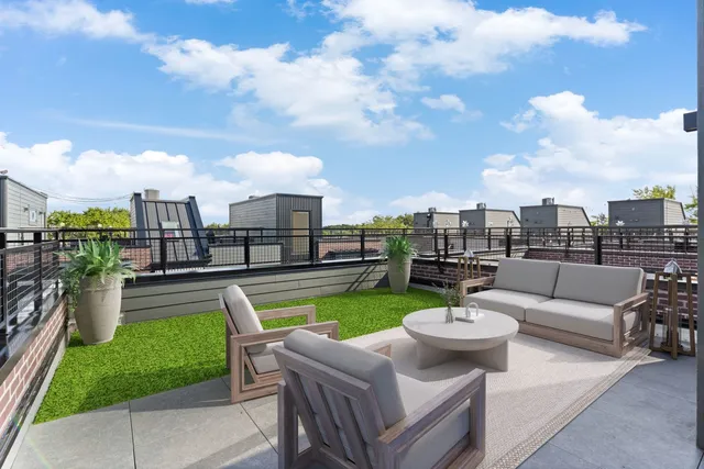 a view of a terrace with sitting area