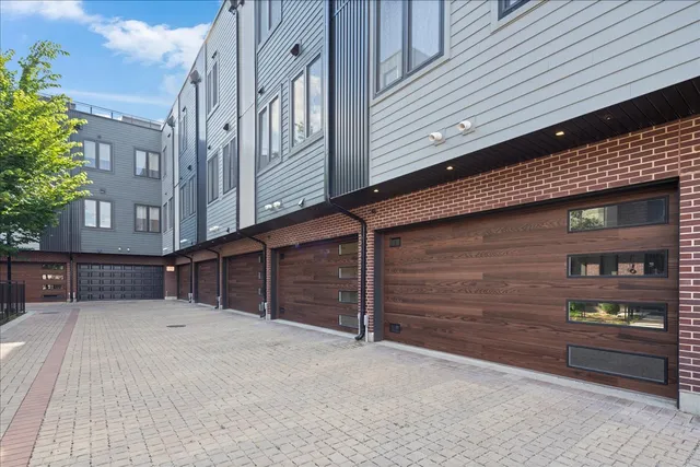 a view of a backyard with a patio and outdoor seating