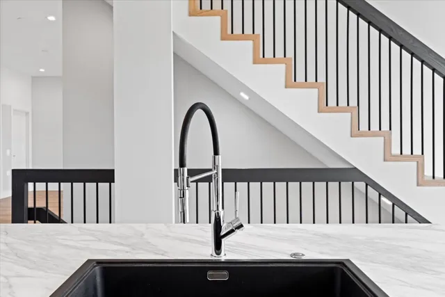 a view of balcony with a sink and wooden floor