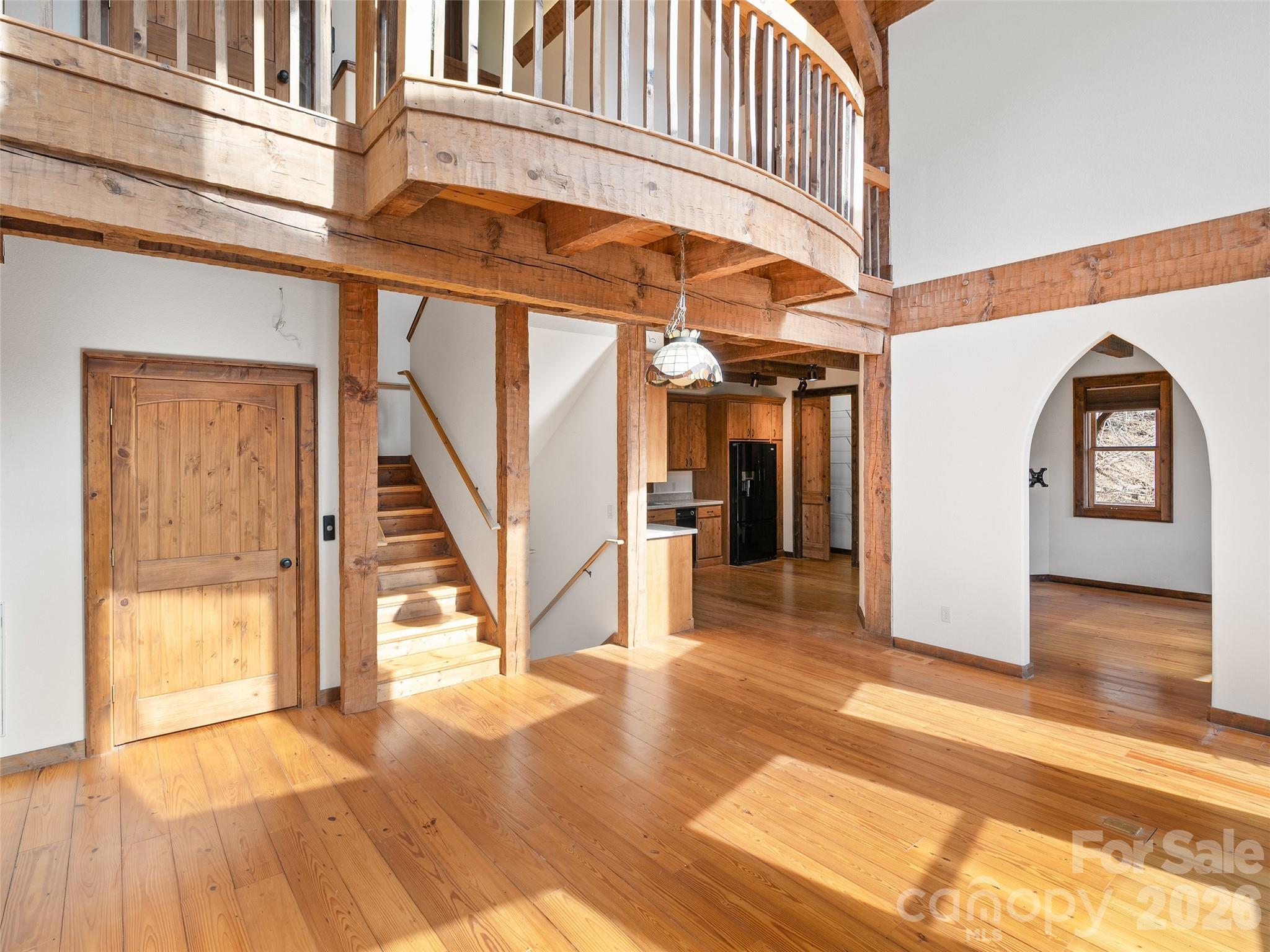 173 Heavenview Point Maggie Valley, NC 28751 - Photo 16 of 47 a view of a hallway with wooden floor and staircase