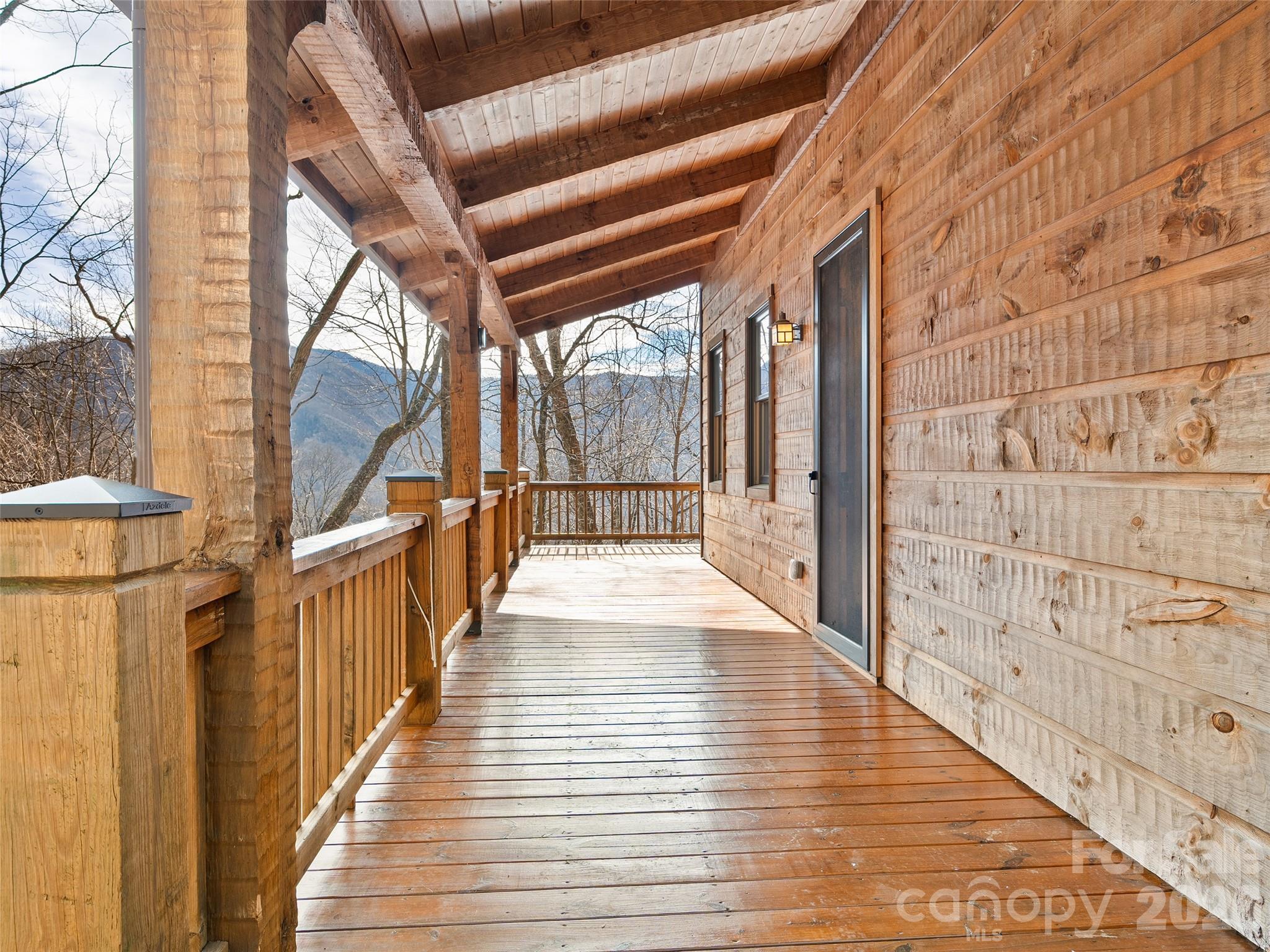 173 Heavenview Point Maggie Valley, NC 28751 - Photo 19 of 47 a view of a porch with wooden floor and stairs