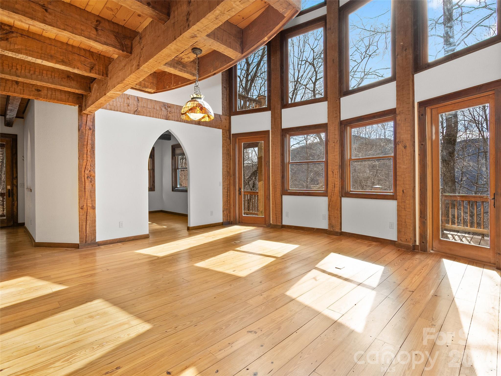 173 Heavenview Point Maggie Valley, NC 28751 - Photo 23 of 47 a view of an empty room with wooden floor and a window
