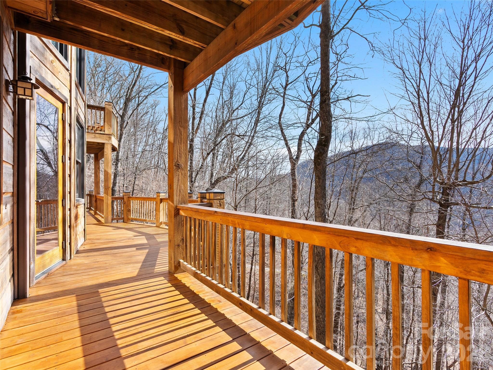 173 Heavenview Point Maggie Valley, NC 28751 - Photo 24 of 47 a view of a balcony with wooden floor and fence