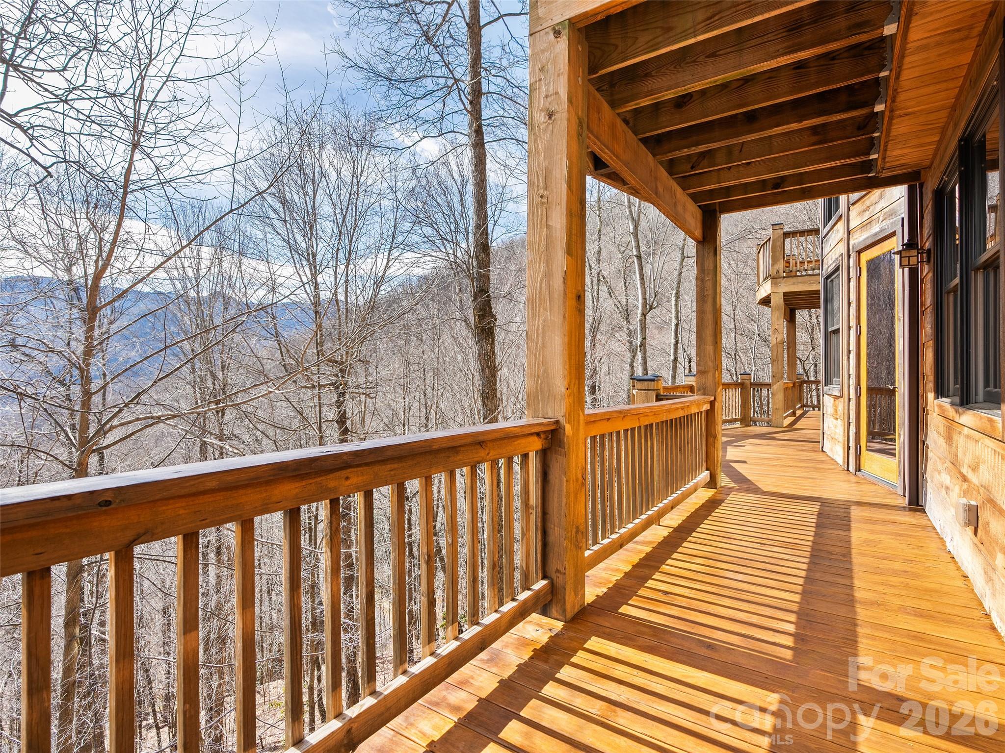 173 Heavenview Point Maggie Valley, NC 28751 - Photo 25 of 47 a view of a balcony with wooden floor and furniture