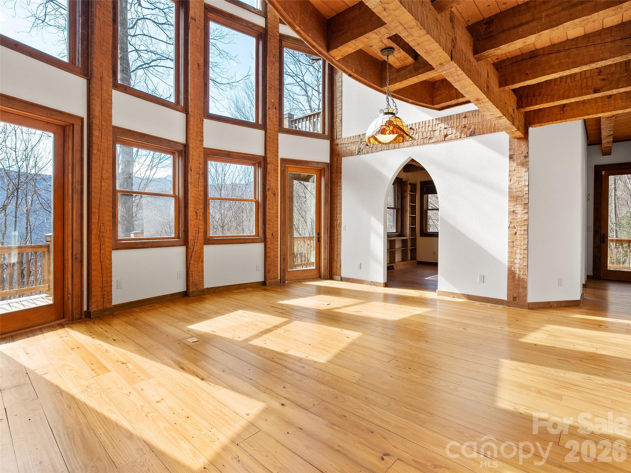 173 Heavenview Point Maggie Valley, NC 28751 - Photo 26 of 47 a view of an empty room with wooden floor and a window