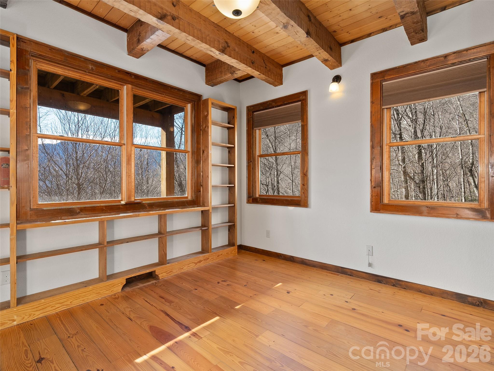 173 Heavenview Point Maggie Valley, NC 28751 - Photo 28 of 47 an empty room with wooden floor and windows