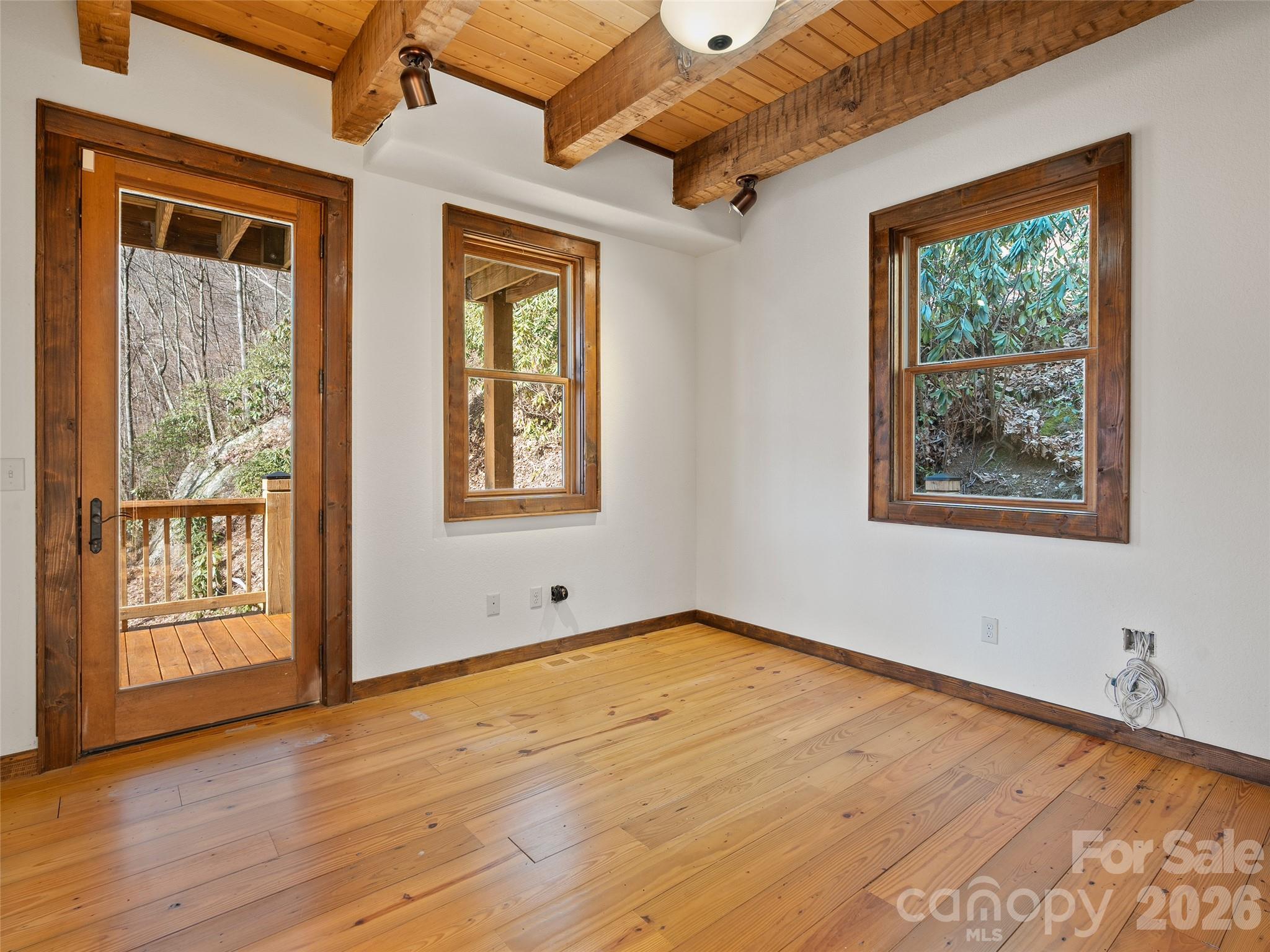 173 Heavenview Point Maggie Valley, NC 28751 - Photo 31 of 47 an empty room with wooden floor and windows