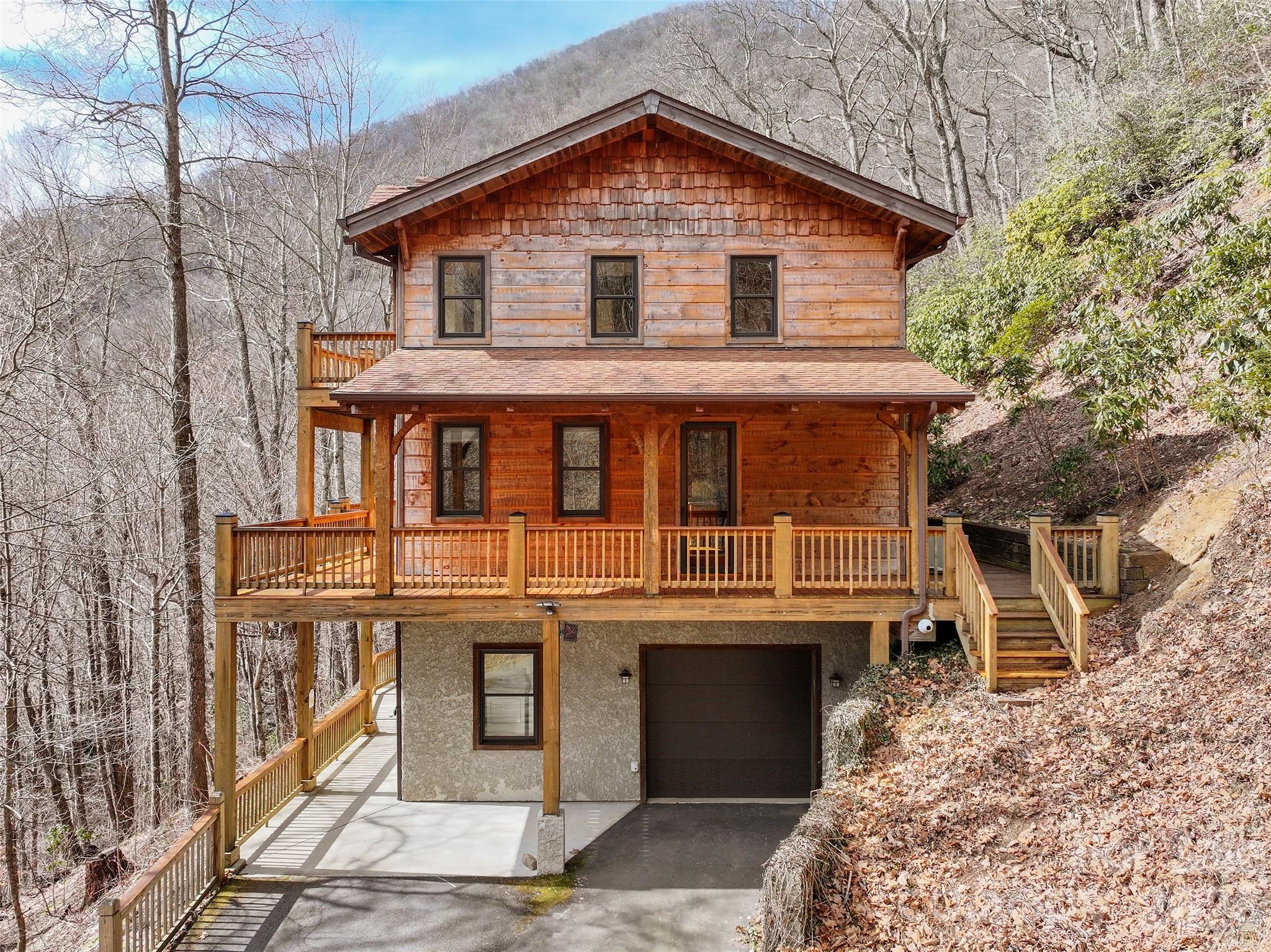 173 Heavenview Point Maggie Valley, NC 28751 - Photo 4 of 47 a front view of a house with a yard