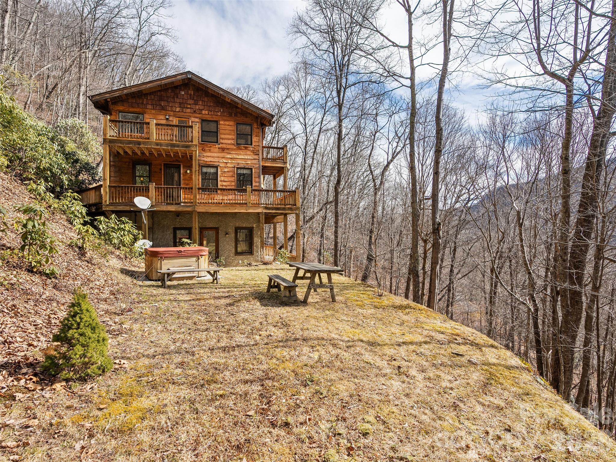 173 Heavenview Point Maggie Valley, NC 28751 - Photo 46 of 47 a view of a house with large trees and covered with snow